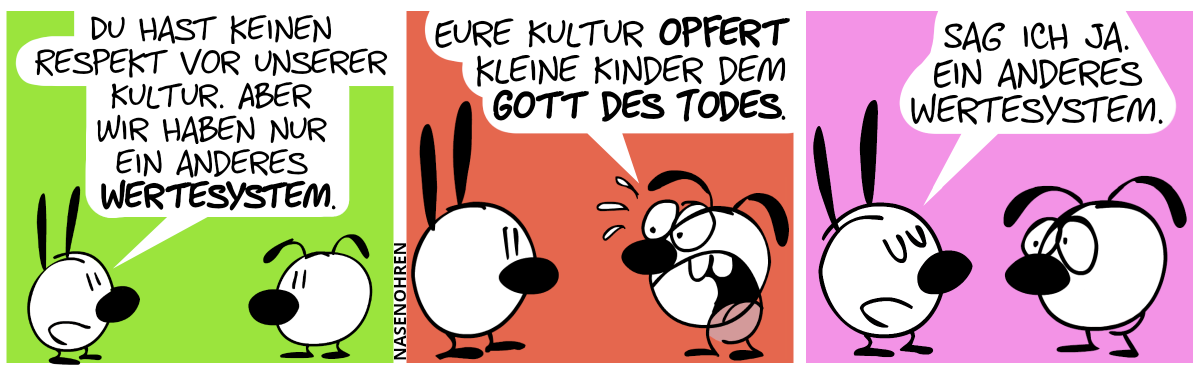 Mimi: „Du hast keinen Respekt vor unserer Kultur. Aber wir haben nur ein anderes Wertesystem.“ / Eumel brüllt entsetzt: „Eure Kultur opfert kleine Kinder dem Gott des Todes.“ / Mimi antwortet ruhig: „Sag ich ja. Ein anderes Wertesystem.“